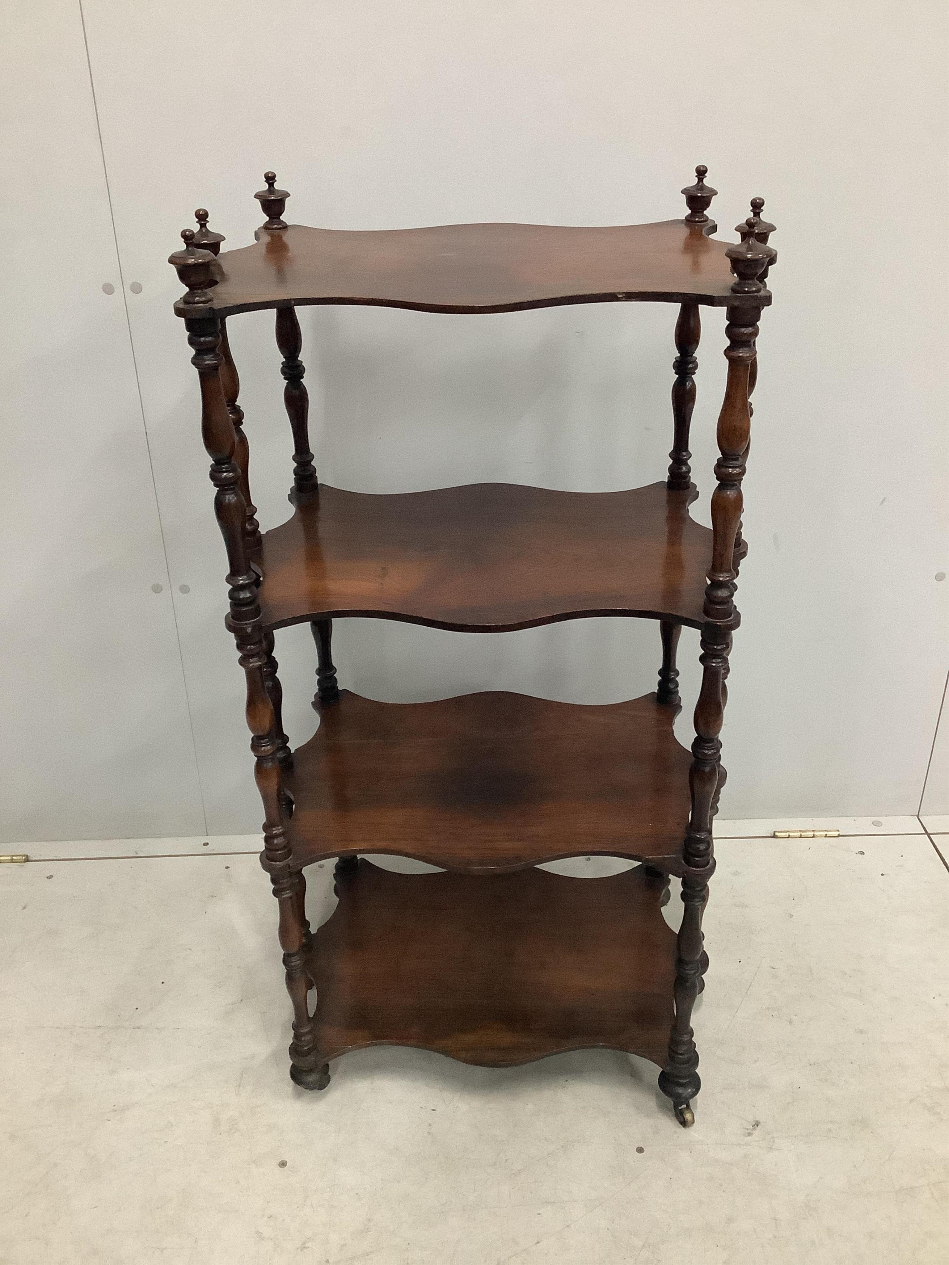 A Victorian four tier rosewood whatnot, width 57cm, depth 37cm, height 108cm. Condition - fair